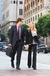 Photo: Businessman And Businesswoman In Street With Takeaway Coffee Businessman And Businesswoman In Street With Takeaway Coffee