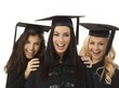 Closeup portrait of happy female graduates