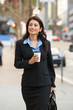 Businesswoman Walking Along St...