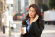 Photo: Businesswoman Outside Office On Mobile Phone Businesswoman Outside Office On Mobile Phone