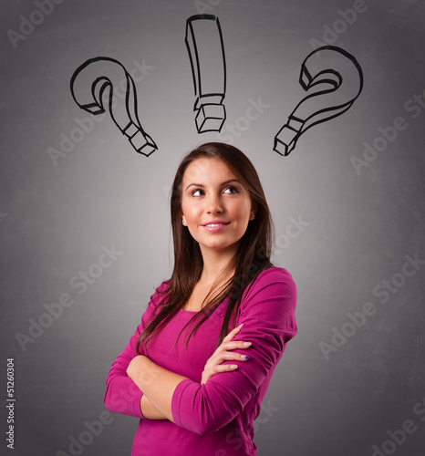 Photo: Young lady thinking with question marks overhead Young lady thinking with question marks overhead