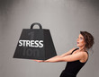 Young woman holding one ton of stress weight