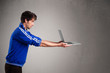 Attractive man holding modern notebook