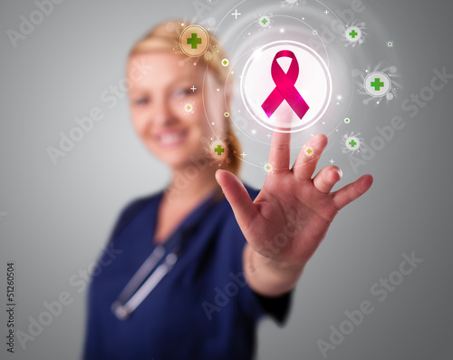 Photo: Young nurse pressing modern medical type of buttons Young nurse pressing modern medical type of buttons