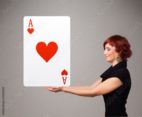 Photo: Beautifu woman holding a red heart ace Beautifu woman holding a red heart ace