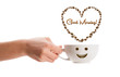 Photo: Coffee mug with coffee beans shaped heart with good morning sign Coffee mug with coffee beans shaped heart with good morning sign