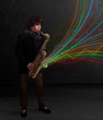 Attractive musician playing on saxophone while colorful abstract