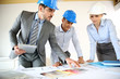 Team of architects presenting construction project