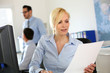 Businesswoman reading document at work