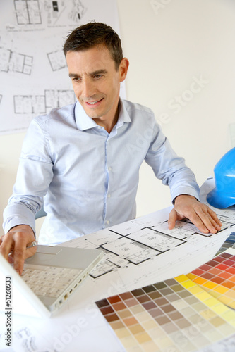 Photo: Architect working on laptop computer Architect working on laptop computer