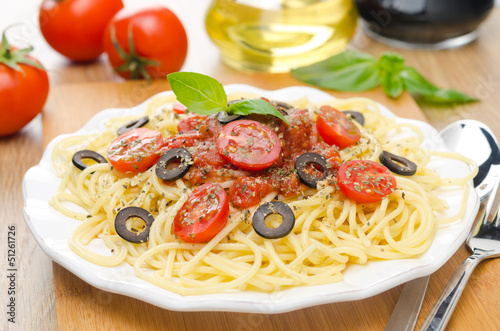 Photo: spaghetti with tomato sauce, cherry tomatoes and olives spaghetti with tomato sauce, cherry tomatoes and olives