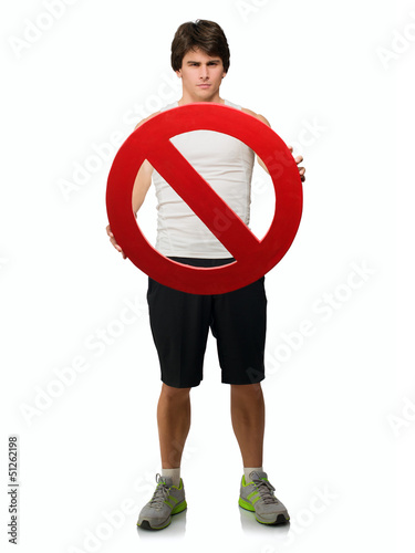 Photo: Young Man Holding Forbidden Sign Young Man Holding Forbidden Sign