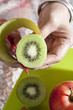 hand hold kiwi fruit