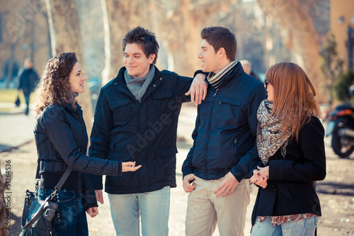 Photo: Group of Friends Talking Outside Group of Friends Talking Outside