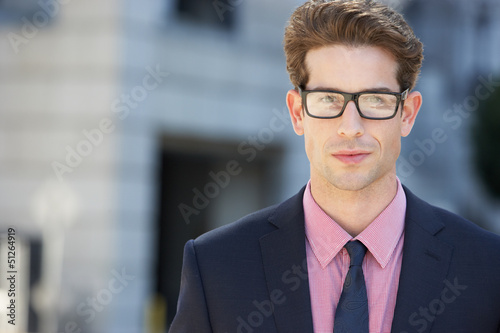 Photo: Portrait Of Businessman Outside Office Portrait Of Businessman Outside Office