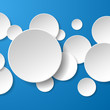 Abstract white paper circles on blue background