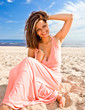 girl in pink dress on seacoast