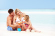 Photo: Family On Playing On Beautiful Beach Family On Playing On Beautiful Beach
