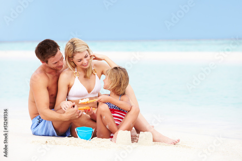 Photo: Family On Playing On Beautiful Beach Family On Playing On Beautiful Beach