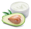 Jar of cream and slices of avocado.