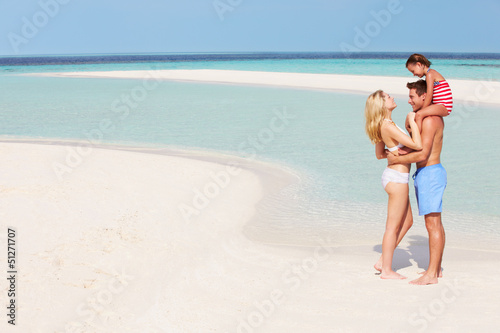 Photo: Family Having Fun In Sea On Beach Holiday Family Having Fun In Sea On Beach Holiday