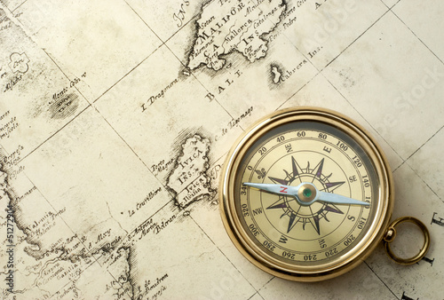 Photo: old compass on vintage map 1732 old compass on vintage map 1732