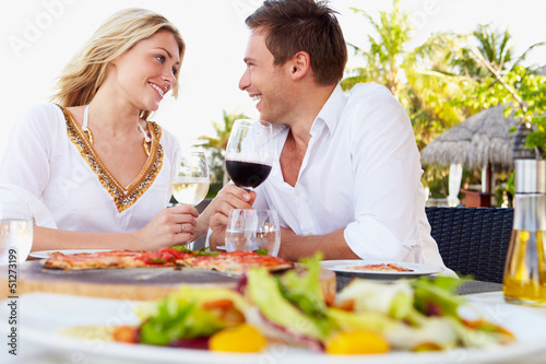 Photo: Couple Enjoying Meal In Outdoor Restaurant Couple Enjoying Meal In Outdoor Restaurant