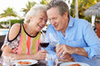 Photo: Senior Couple Enjoying Meal In Outdoor Restaurant Senior Couple Enjoying Meal In Outdoor Restaurant