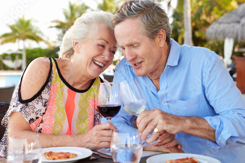 Photo: Senior Couple Enjoying Meal In Outdoor Restaurant Senior Couple Enjoying Meal In Outdoor Restaurant