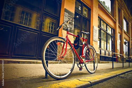 Photo: red bicycle on the street red bicycle on the street