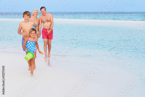 Photo: Grandparents And Grandchildren Having Fun On Beach Holiday Grandparents And Grandchildren Having Fun On Beach Holiday