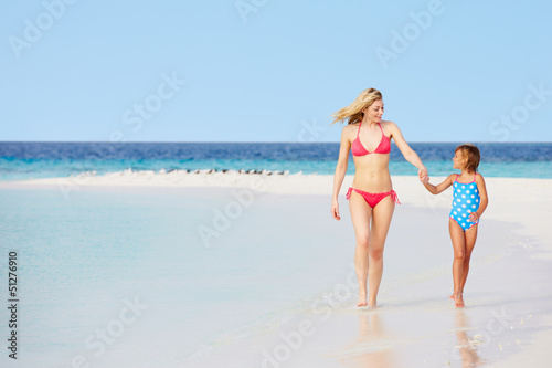Photo: Mother And Daughter Walking On Beautiful Beach Mother And Daughter Walking On Beautiful Beach