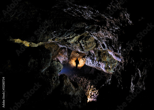 Photo: Caver in a cave, Pugnetto, Mezzenile, Piedmont, Italy Caver in a cave, Pugnetto, Mezzenile, Piedmont, Italy
