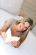Woman relaxing with a book
