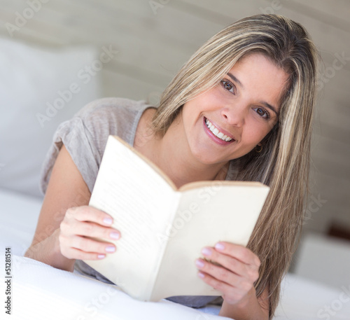 Photo: Woman reading a book Woman reading a book