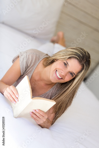 Photo: Woman relaxing with a book Woman relaxing with a book