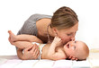 Young Caucasian woman kissing her baby son