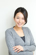 Beautiful asian woman relaxing on white background