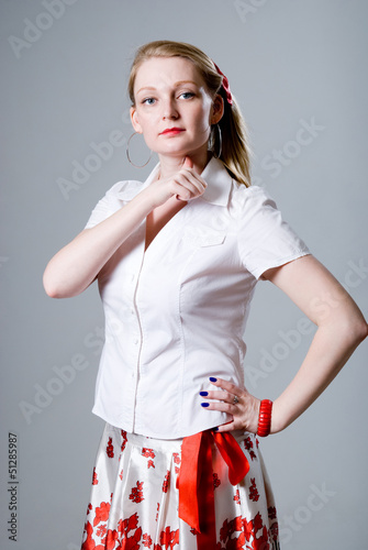 Photo: A beautiful woman with a thumb to the throat. A beautiful woman with a thumb to the throat.