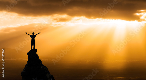 Photo: man on the top of a rock man on the top of a rock