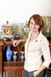 Foto: Woman with antique collection Woman with antique collection
