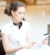 Business woman using tablet on lunch break in cafe