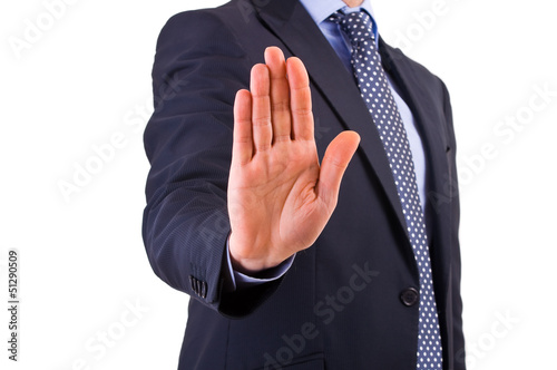Photo: Businessman indicating stop with his hand. Businessman indicating stop with his hand.