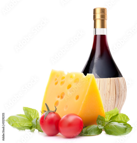 Photo: Red wine bottle, cheese and tomato still life Red wine bottle, cheese and tomato still life