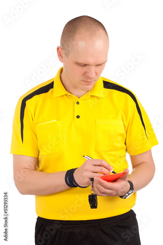 Photo: Football referee writing on red card Football referee writing on red card