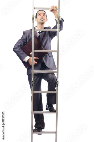 Photo: Businessman climbing the ladder isolated on white Businessman climbing the ladder isolated on white