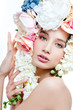 fashion model with large hairstyle and flowers in her hair.