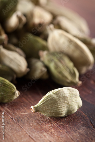 Photo: Cardamome seeds on wooden table Cardamome seeds on wooden table