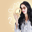 Possessed businesswoman holding a Q for question