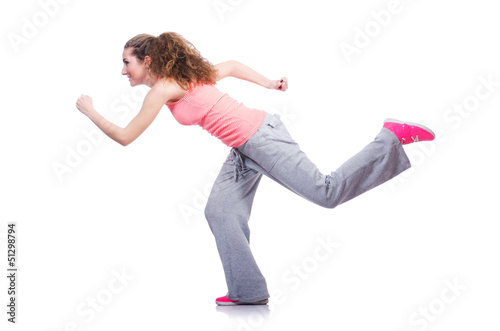 Photo: Young female doing exercises on white Young female doing exercises on white